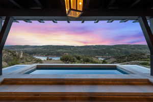 Outdoor plunge pool with stone coping and tile surround