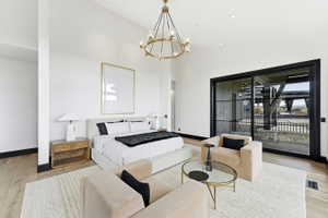 Spacious bedroom featuring light wood-finish flooring and a neutral color palette
