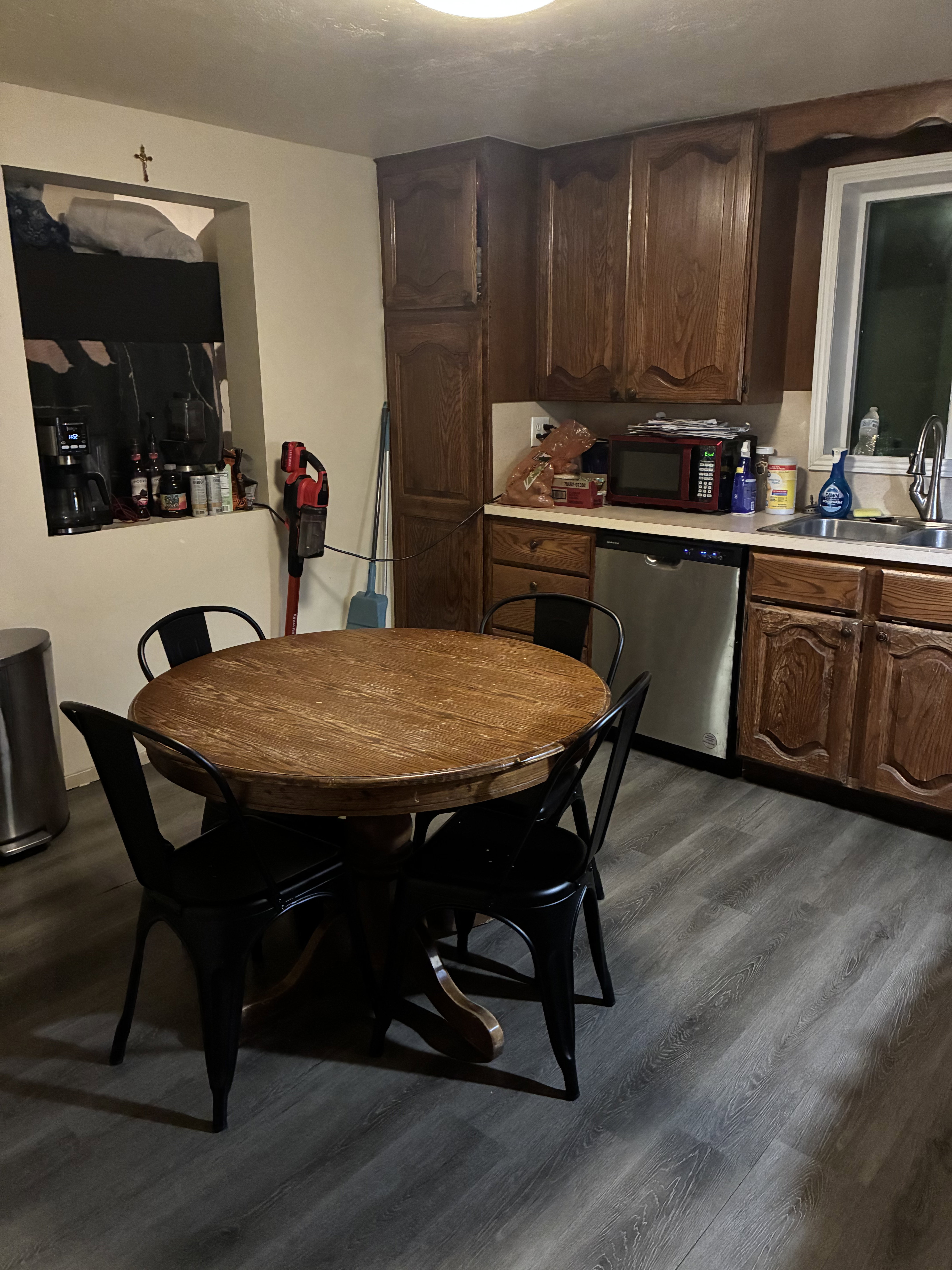 Kitchen area featuring wood-finish flooring and extensive wood cabinetry
