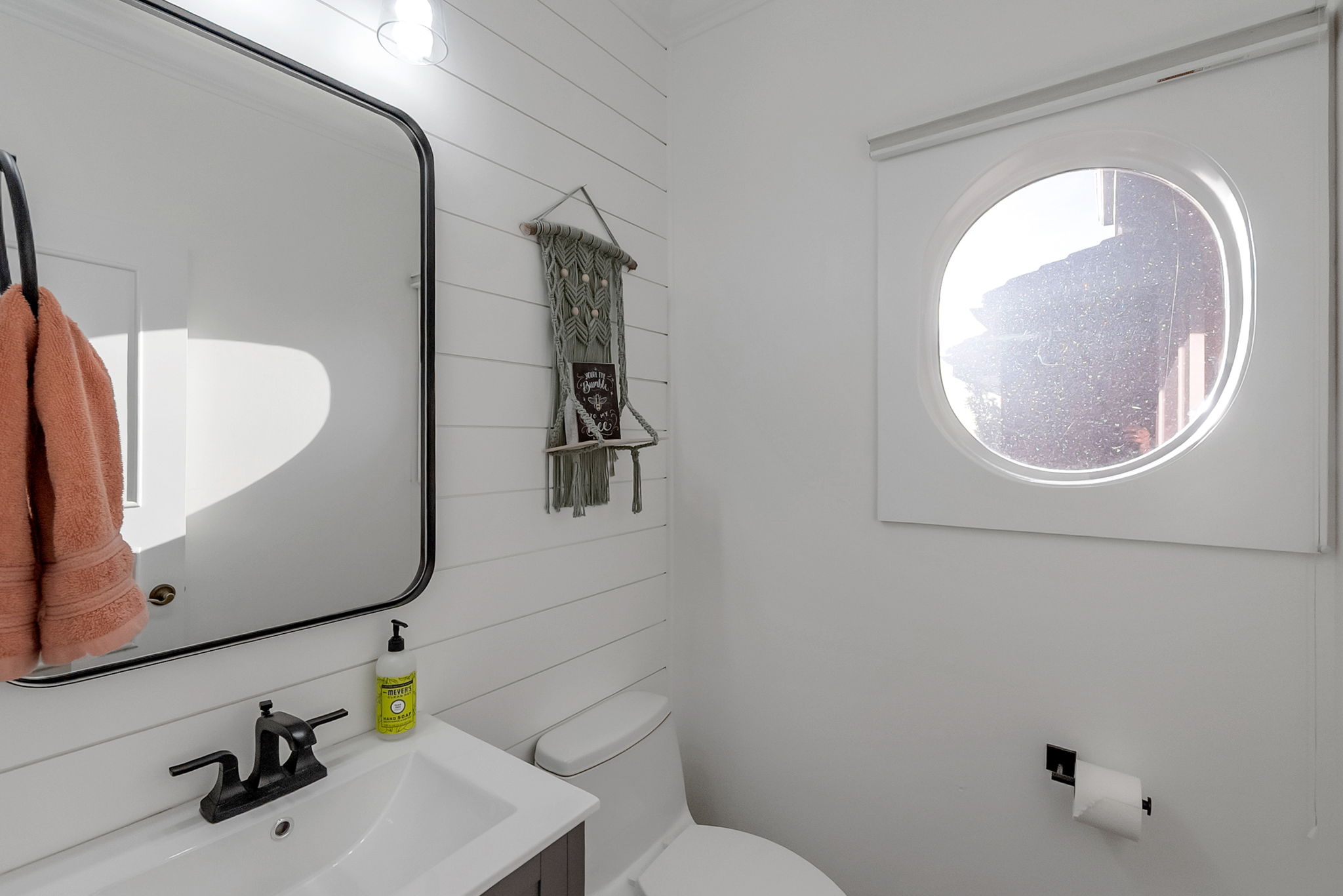 Half bathroom as you go out to the garage.