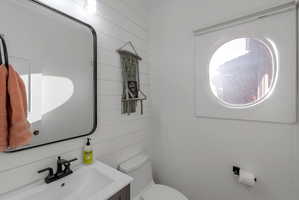 Half bathroom as you go out to the garage.