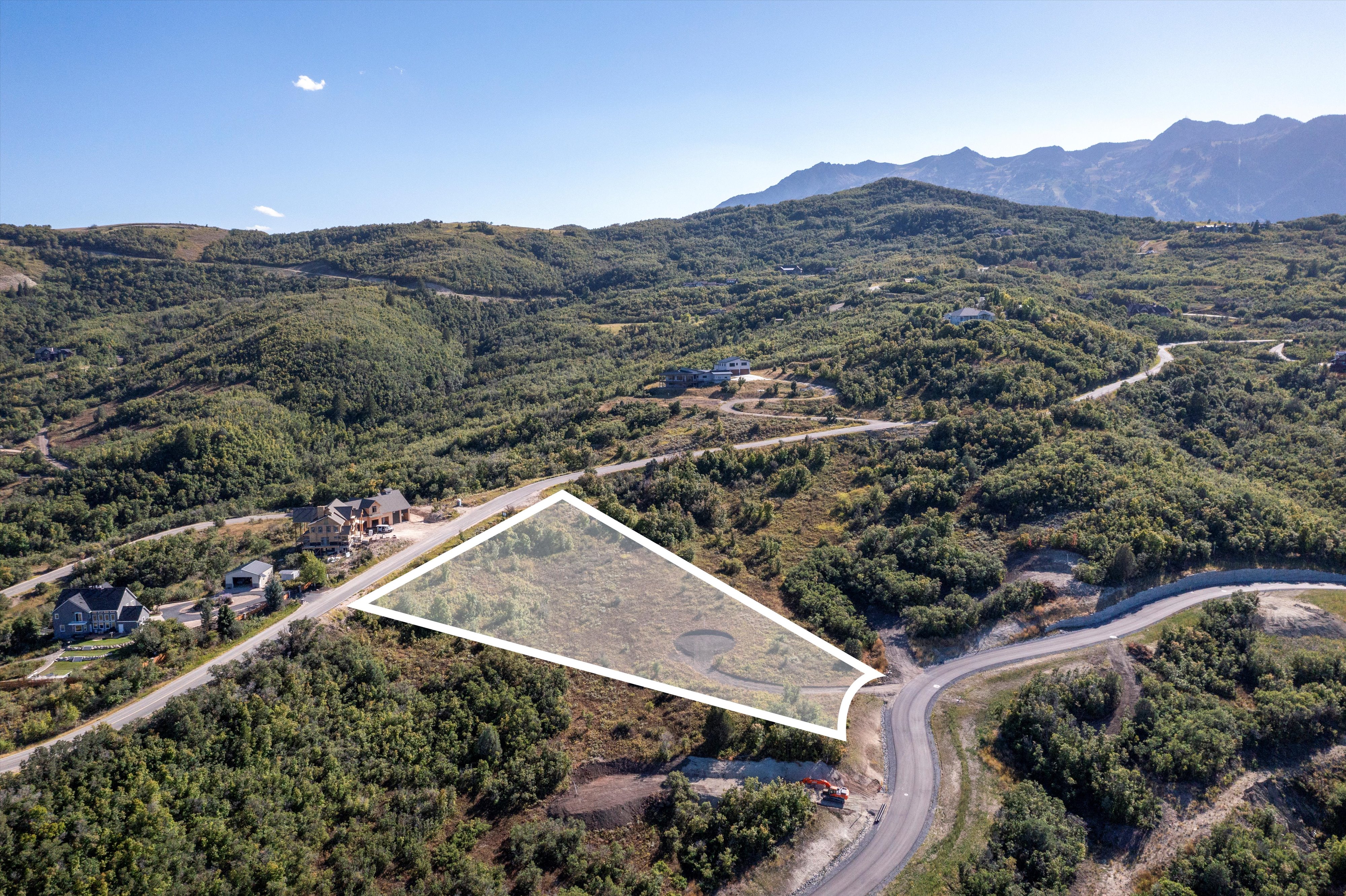 Expansive undeveloped lot with a mountainous backdrop