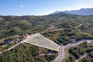 Expansive undeveloped lot with a mountainous backdrop