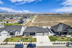 Modern single-story residence featuring a stone and siding exterior