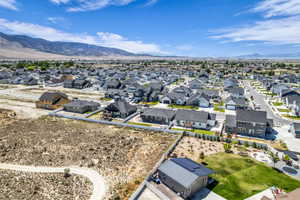 Newer residential development with contemporary homes and mountain backdrop