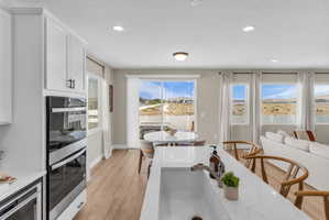 Contemporary kitchen island featuring a deep single-basin sink with a gooseneck faucet