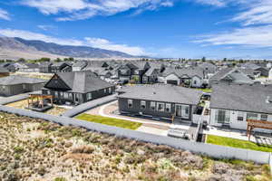 Contemporary residential architecture with dark siding and a prominent gable