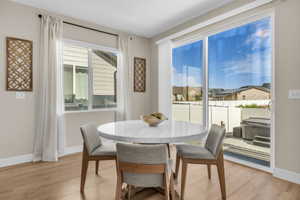 Light wood-finish flooring provides a warm base for the neutral wall paint