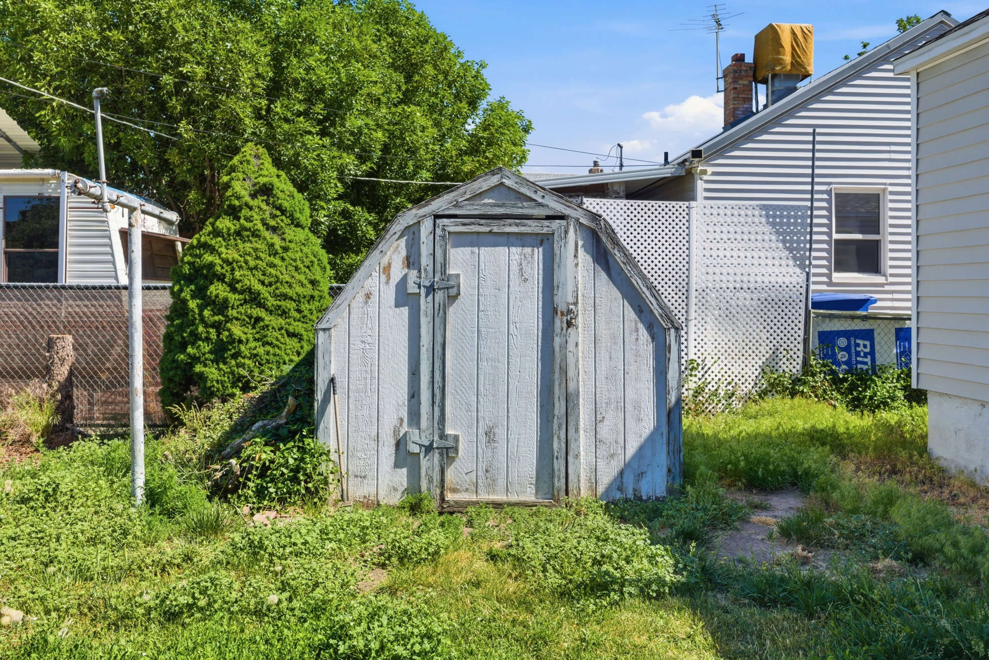 Detached storage shed with a gabled roof