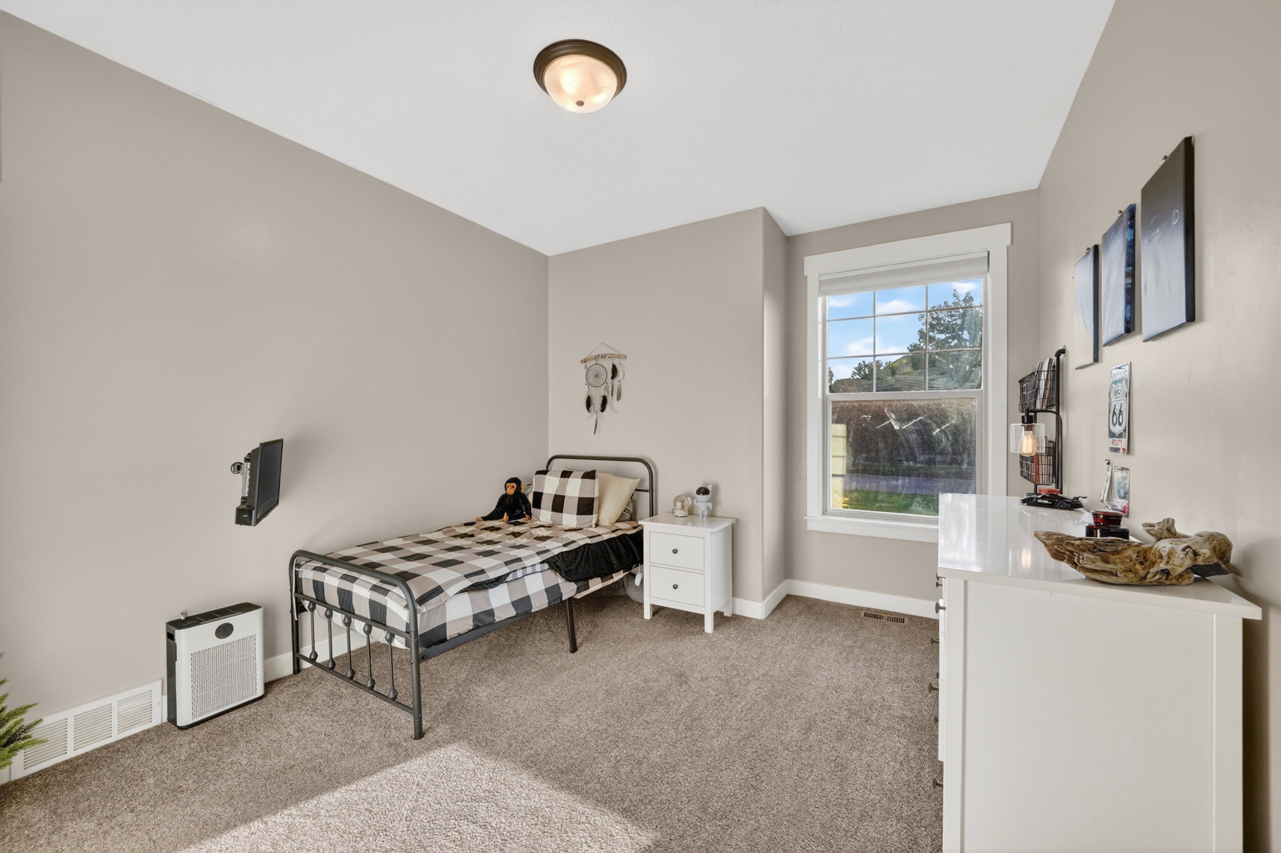 Carpeted room with a double-hung window, crown molding, and a flush mount ceiling light