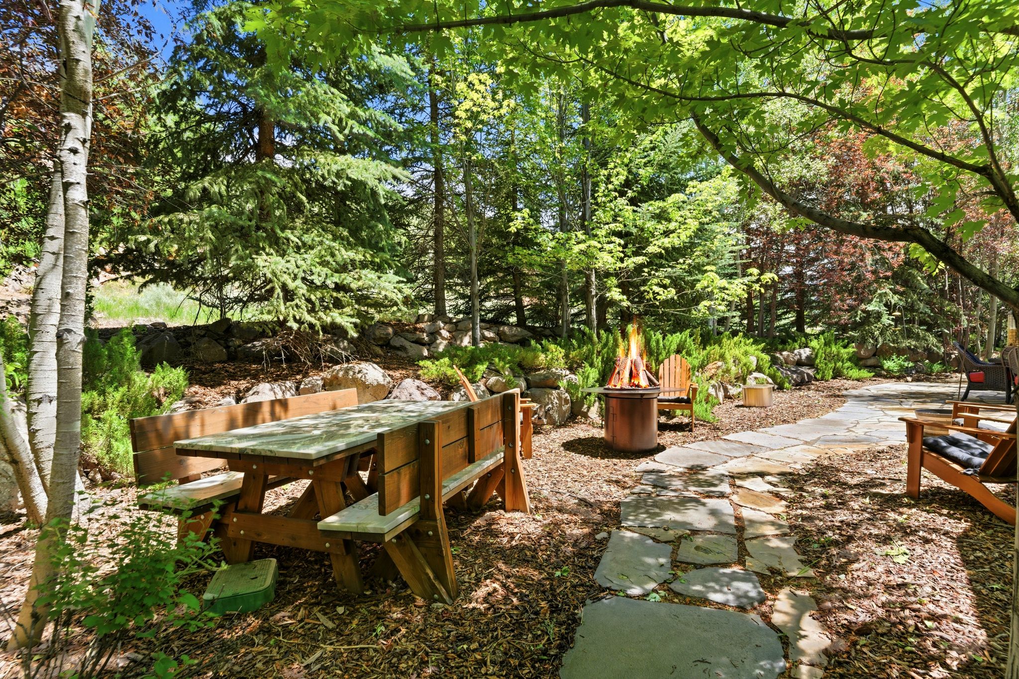 Landscaped outdoor space featuring a flagstone pathway