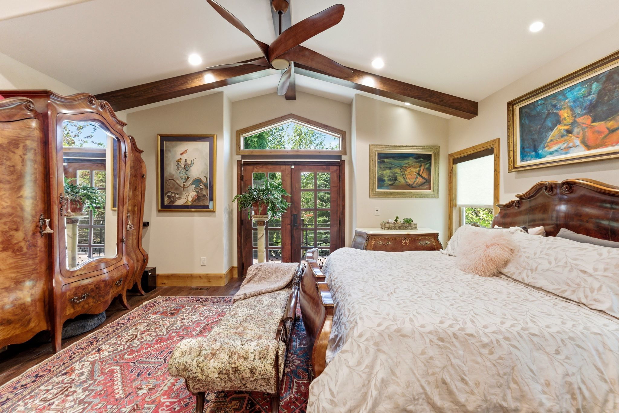 Vaulted ceiling featuring exposed wood beams and recessed lighting