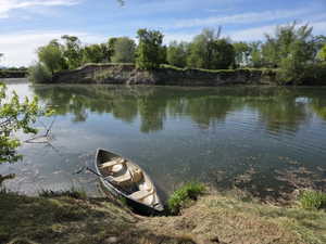 Waterfront access with a canoe at the shoreline
