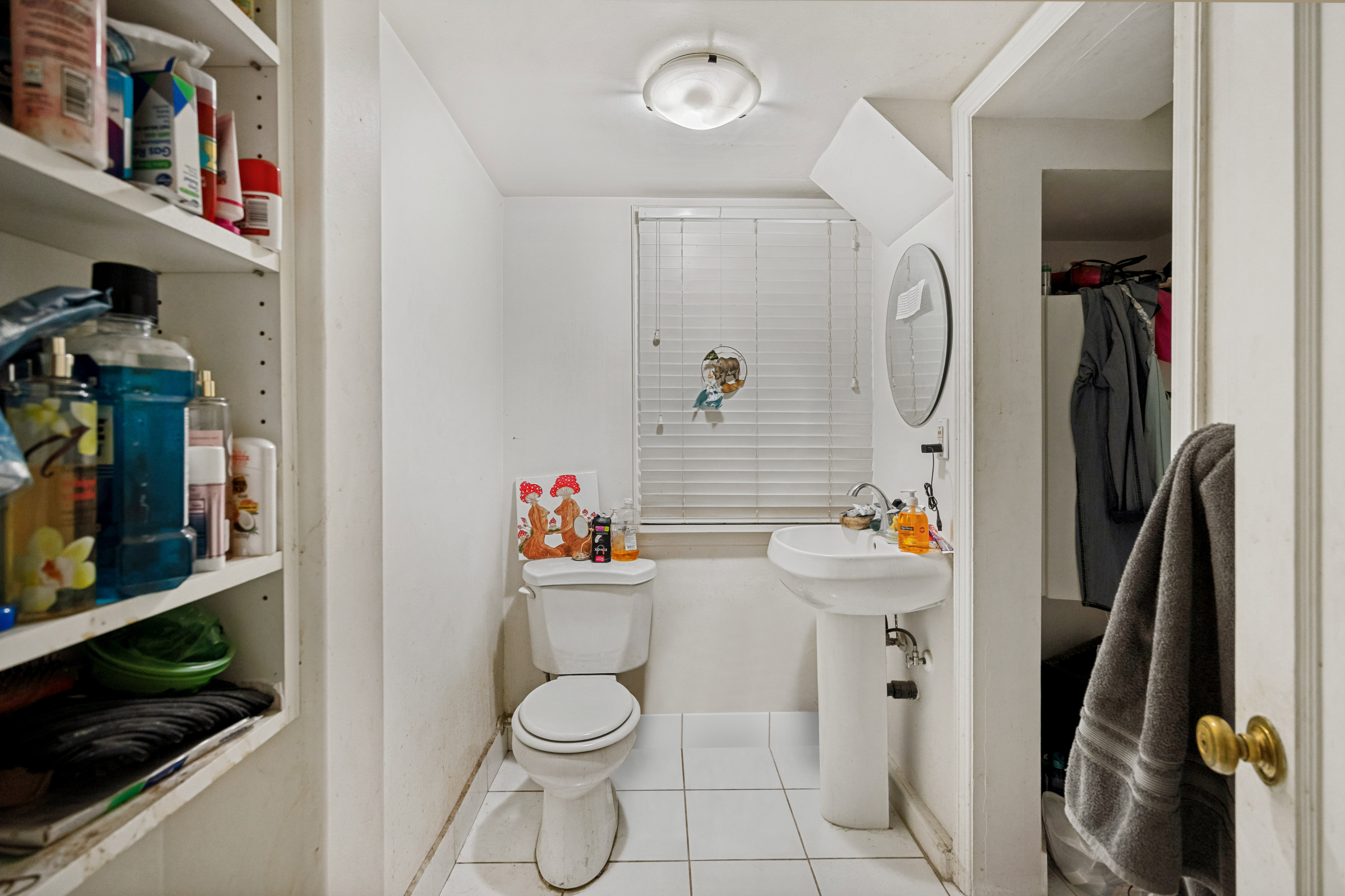Unit 3  Bathroom featuring a pedestal sink, white toilet, and tile flooring