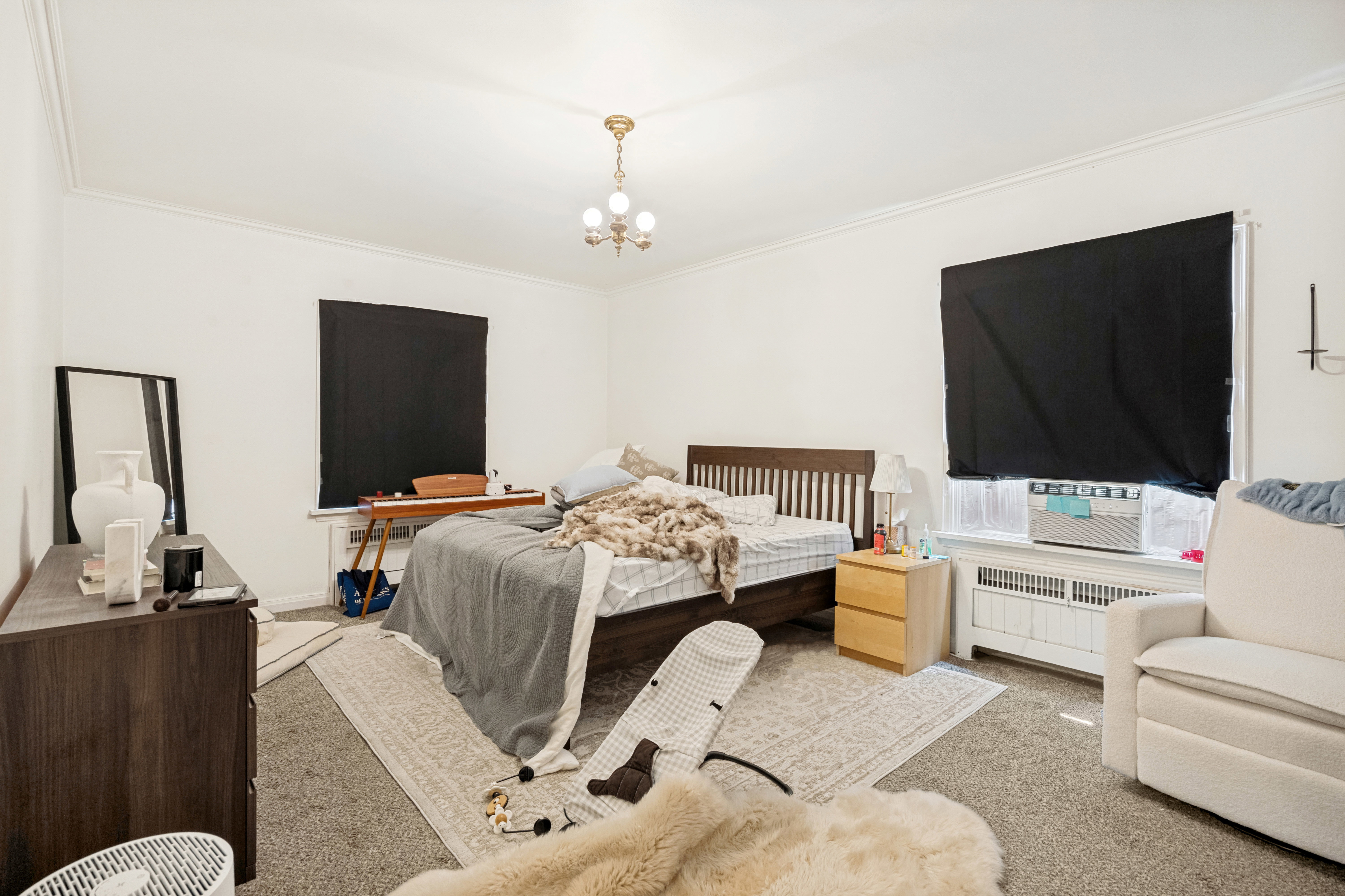 Unit 2 Spacious interior featuring crown molding, neutral wall tones, and recessed window openings