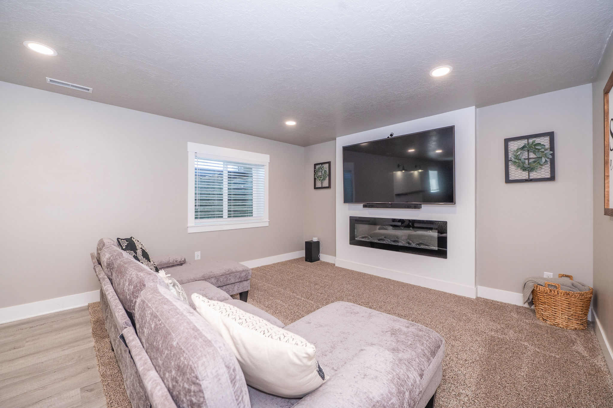 Entertainment area featuring a built-in electric fireplace and wall-mounted television space