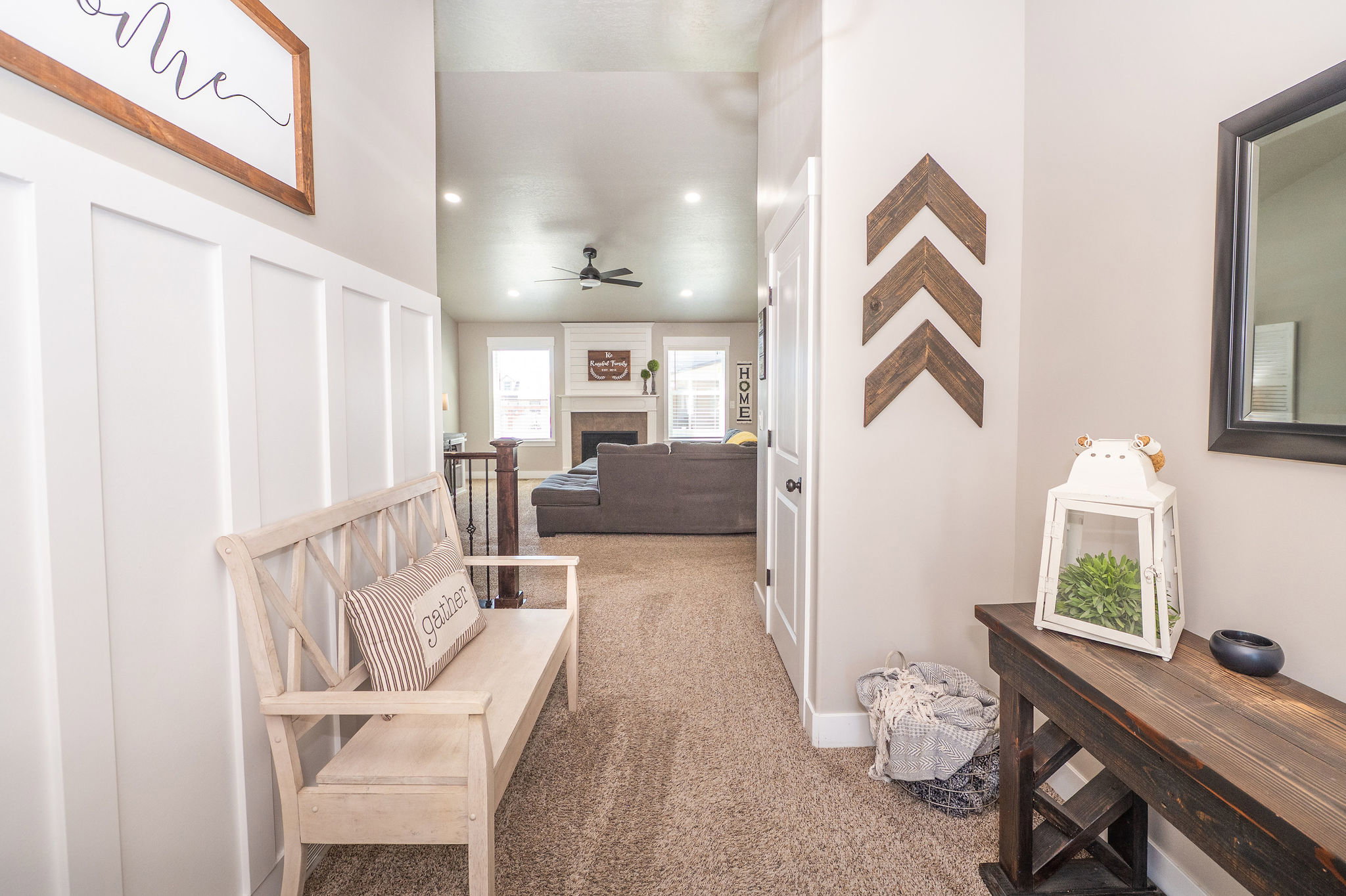 Entryway featuring white board-and-batten accent wall
