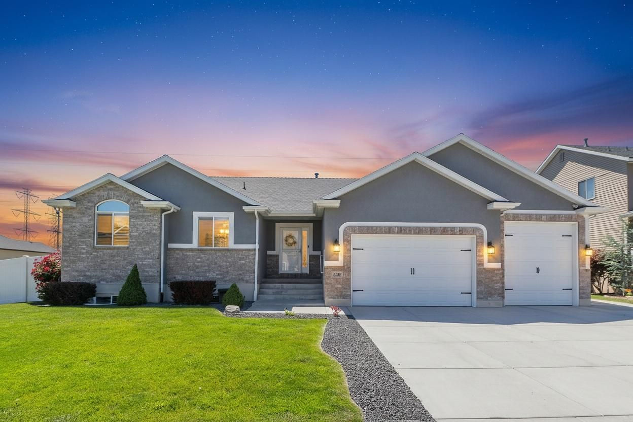Contemporary home exterior featuring stone and stucco finishes