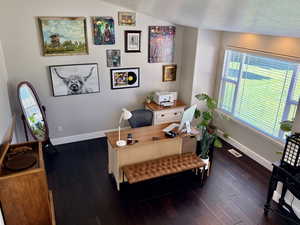 Bright room with dark wood-finish flooring