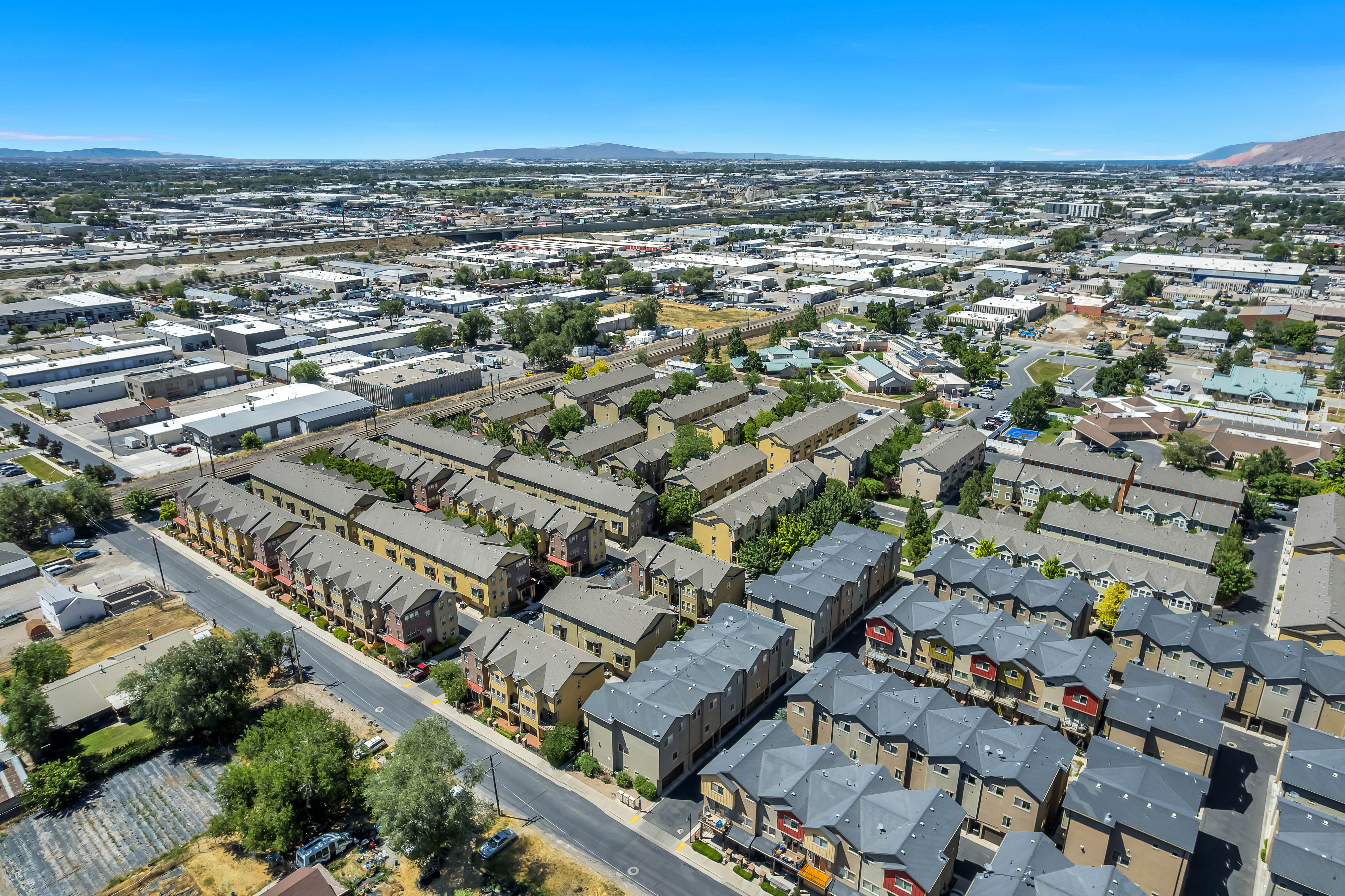 Aerial perspective showcasing a collection of multi-story residential townhomes