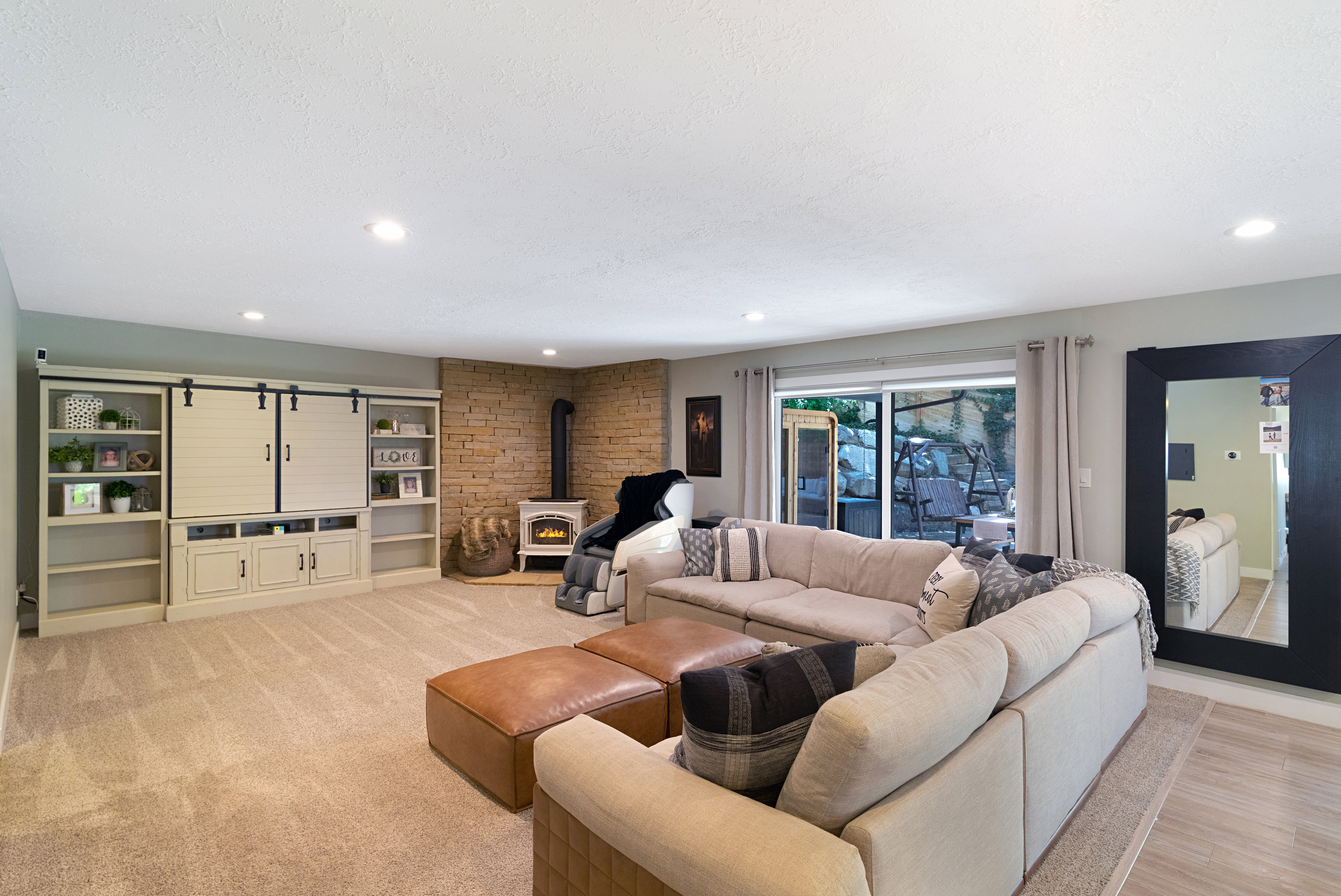 Spacious living area featuring recessed lighting and wall-to-wall carpeting