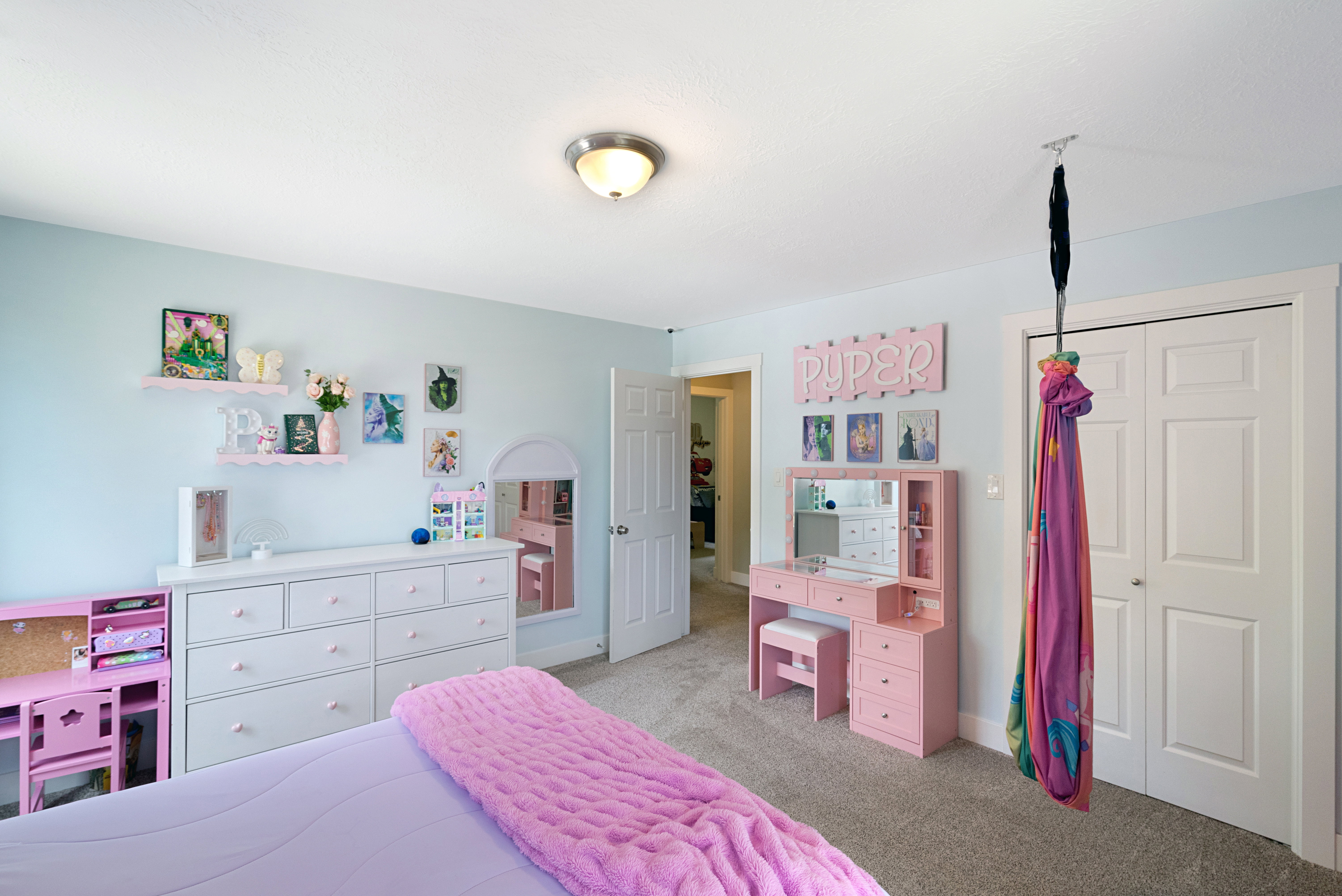 Room featuring light blue walls, gray carpet, and a flush mount ceiling light fixture