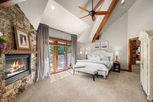 Bedroom featuring access to exterior, light colored carpet, recessed lighting, ceiling fan, and a fireplace