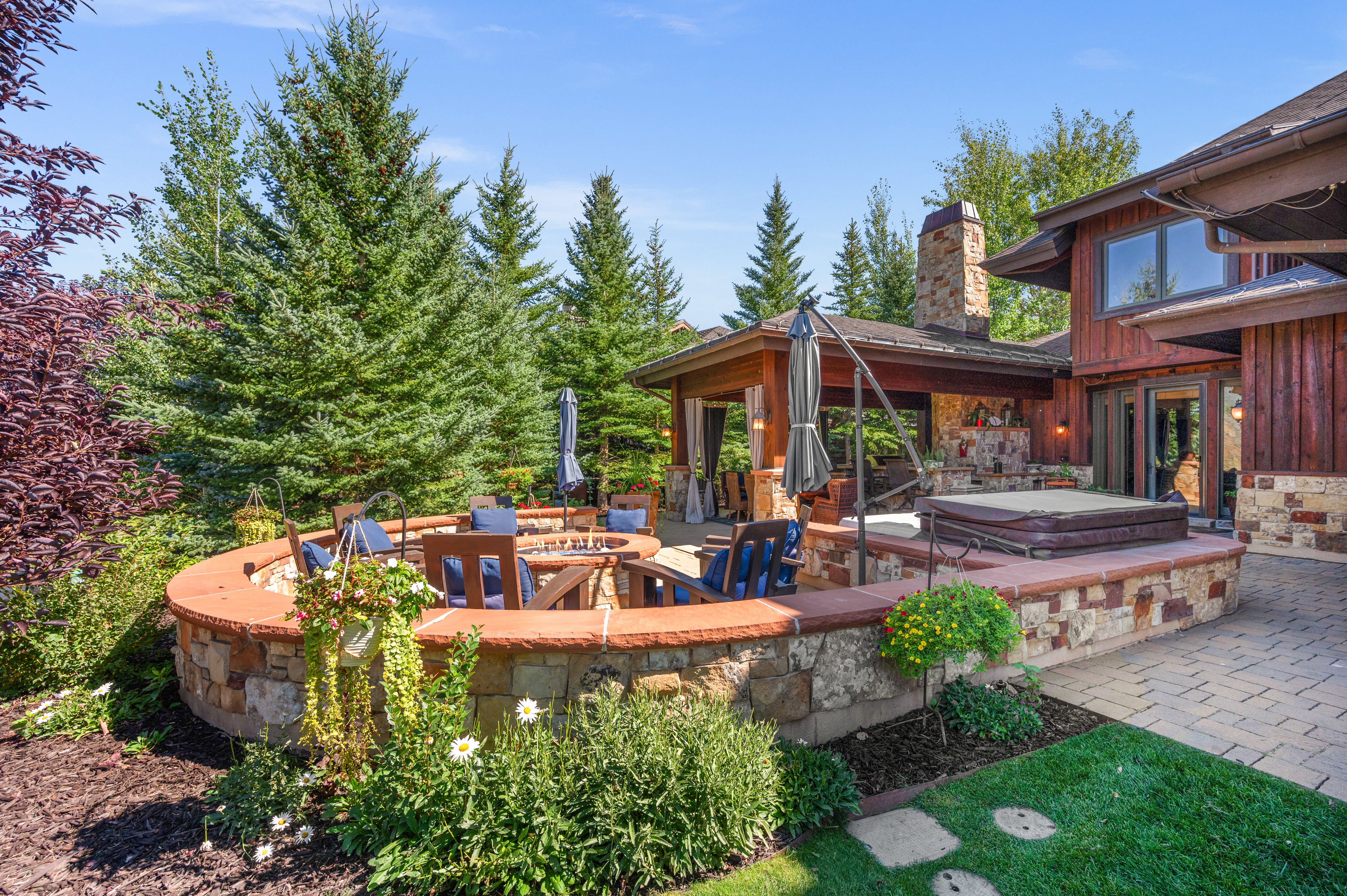 View of patio with a covered hot tub