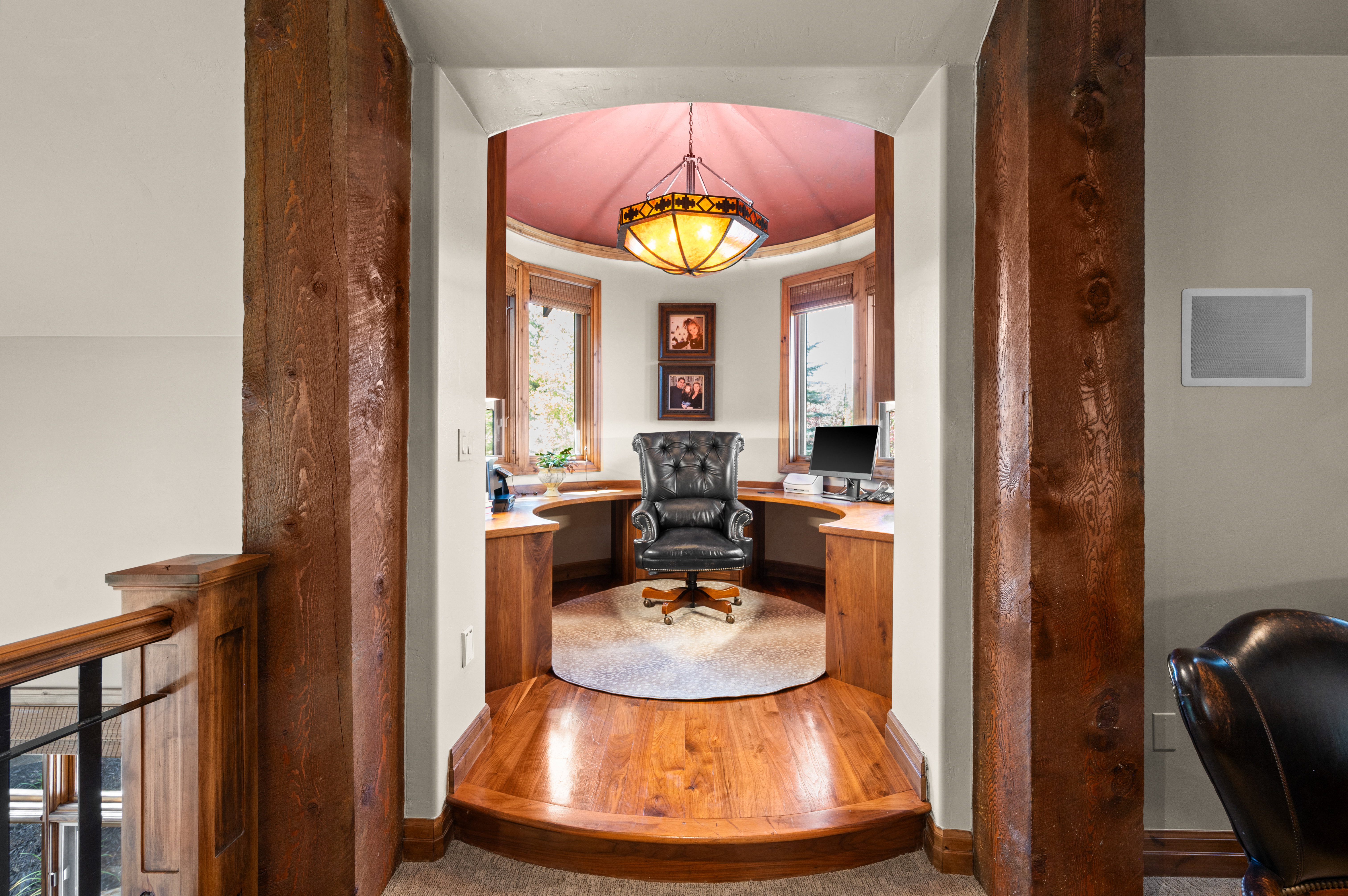 Office featuring wood finished floors and built in study area