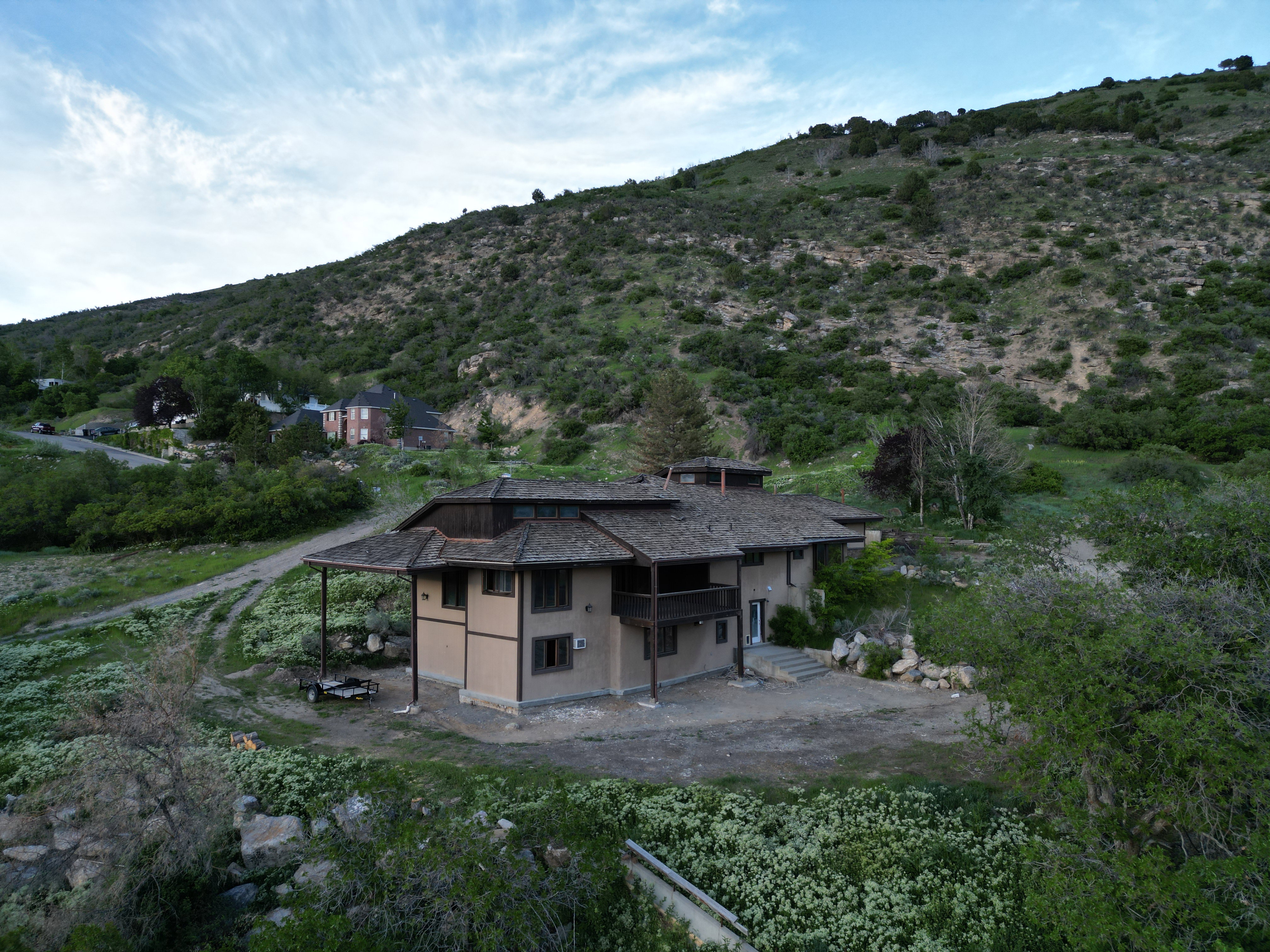 Contemporary multi-level residence featuring stucco and timber-frame exterior detailing