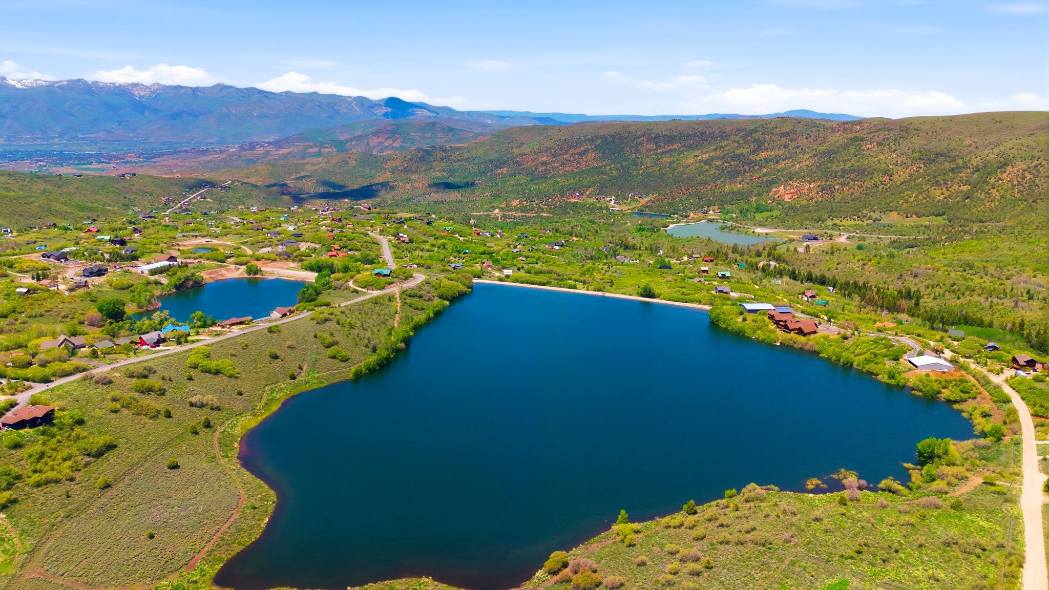 Expansive lakeside parcels with mountain backdrop