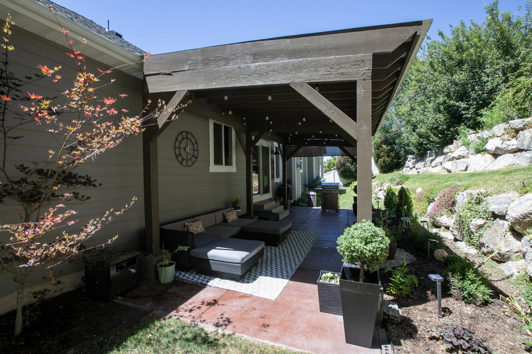 Covered patio featuring a stained concrete surface and a wood pergola