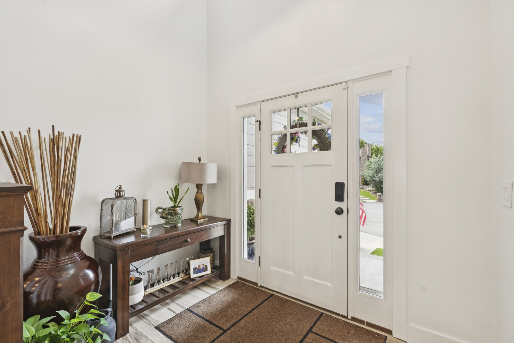 Entrance foyer featuring light wood-style floors