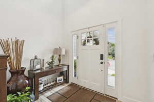 Entrance foyer featuring light wood-style floors