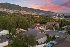 Aerial perspective of suburban area with a mountainous background