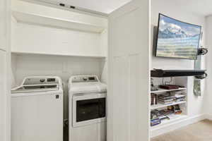 Laundry area with washer and clothes dryer