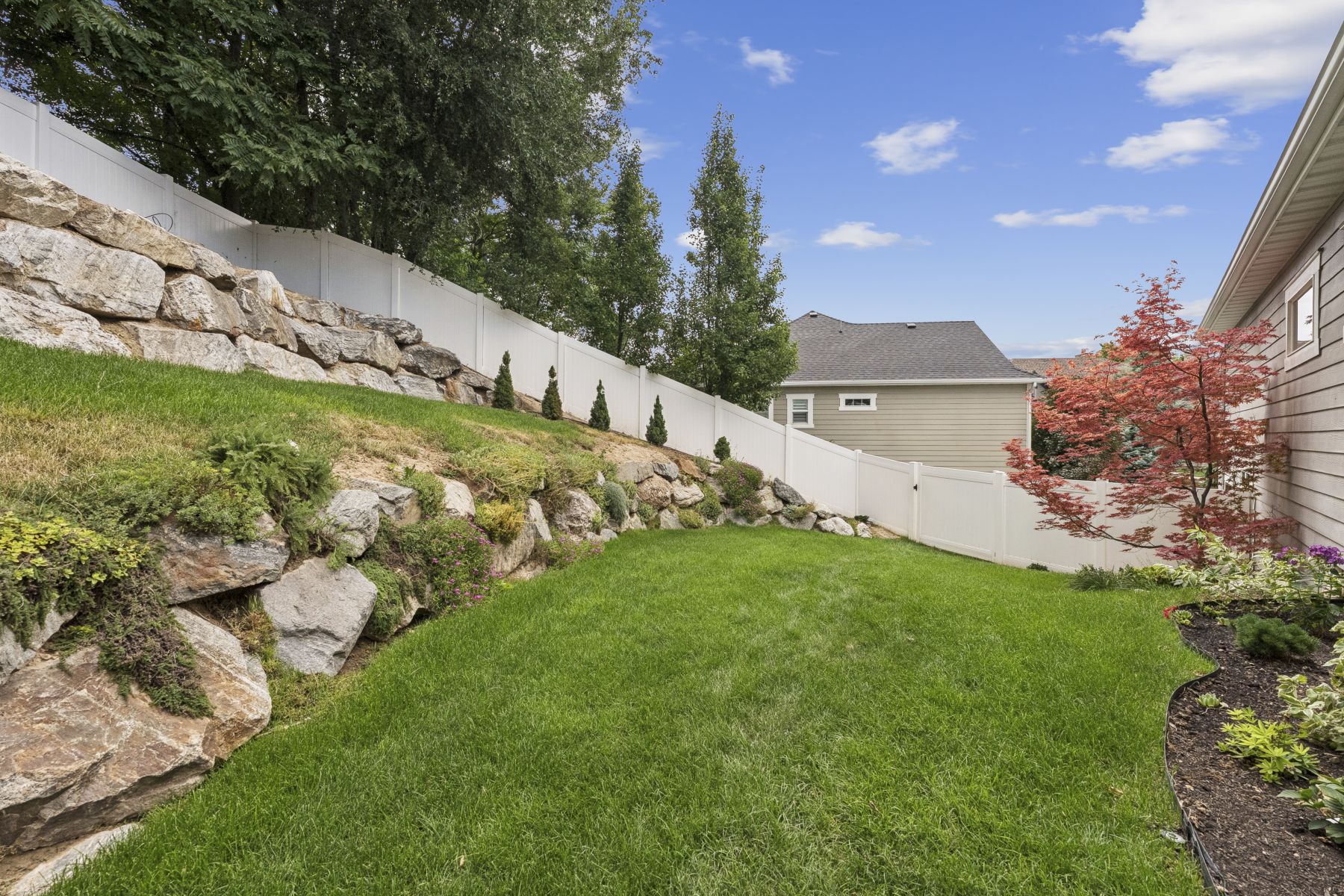 View of fenced backyard