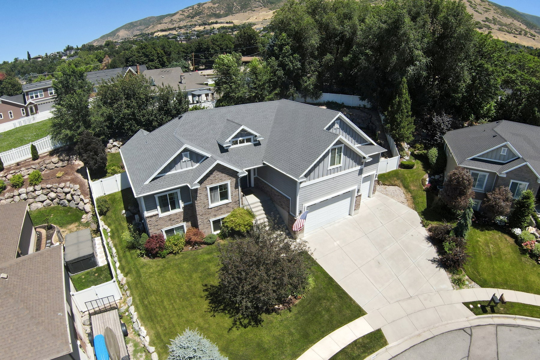 Stone and siding exterior with a multi-level roofline
