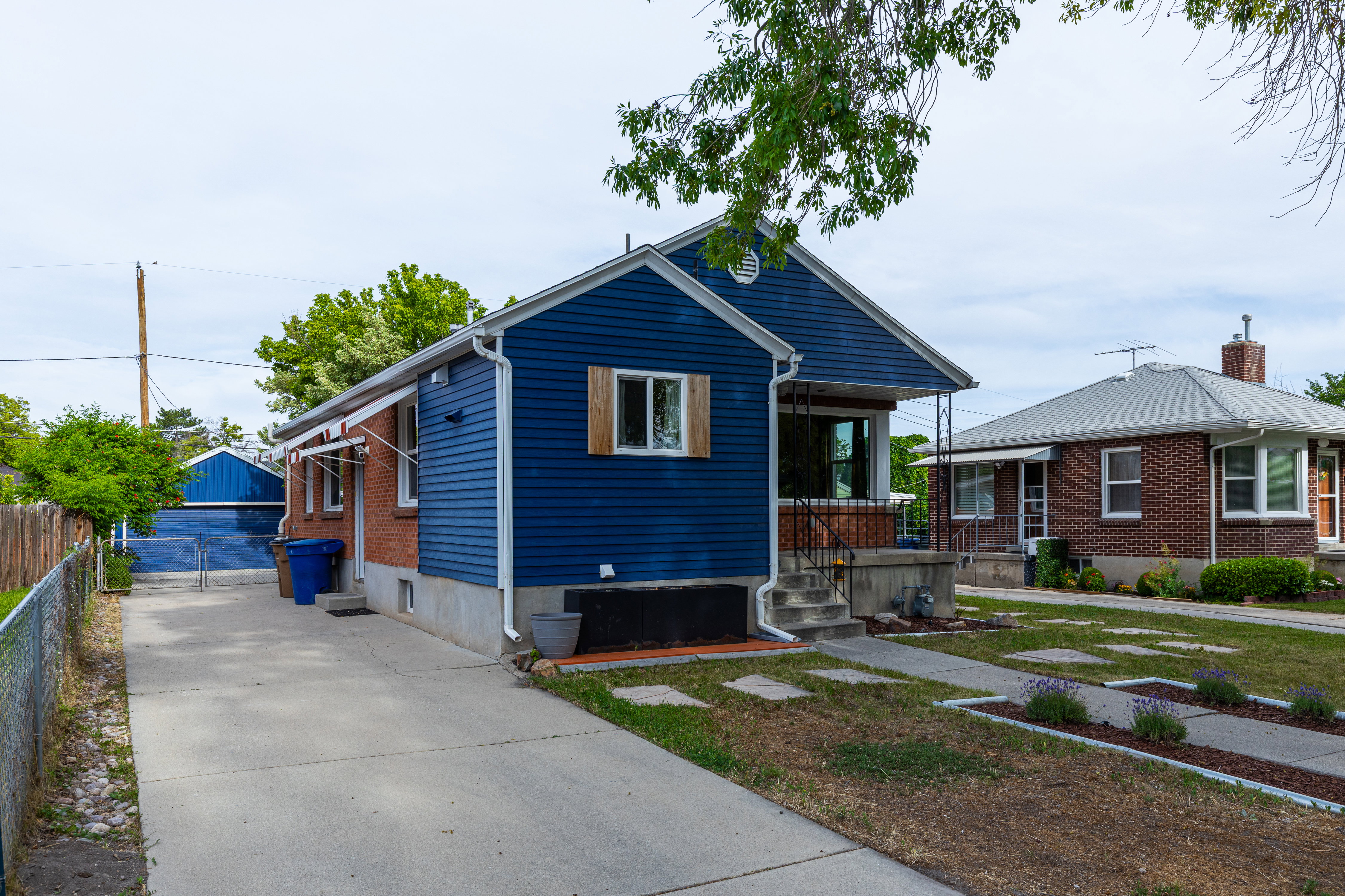 Classic residence featuring blue siding and brick accents