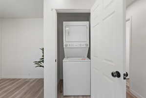 Integrated laundry closet with white stacked washer and dryer