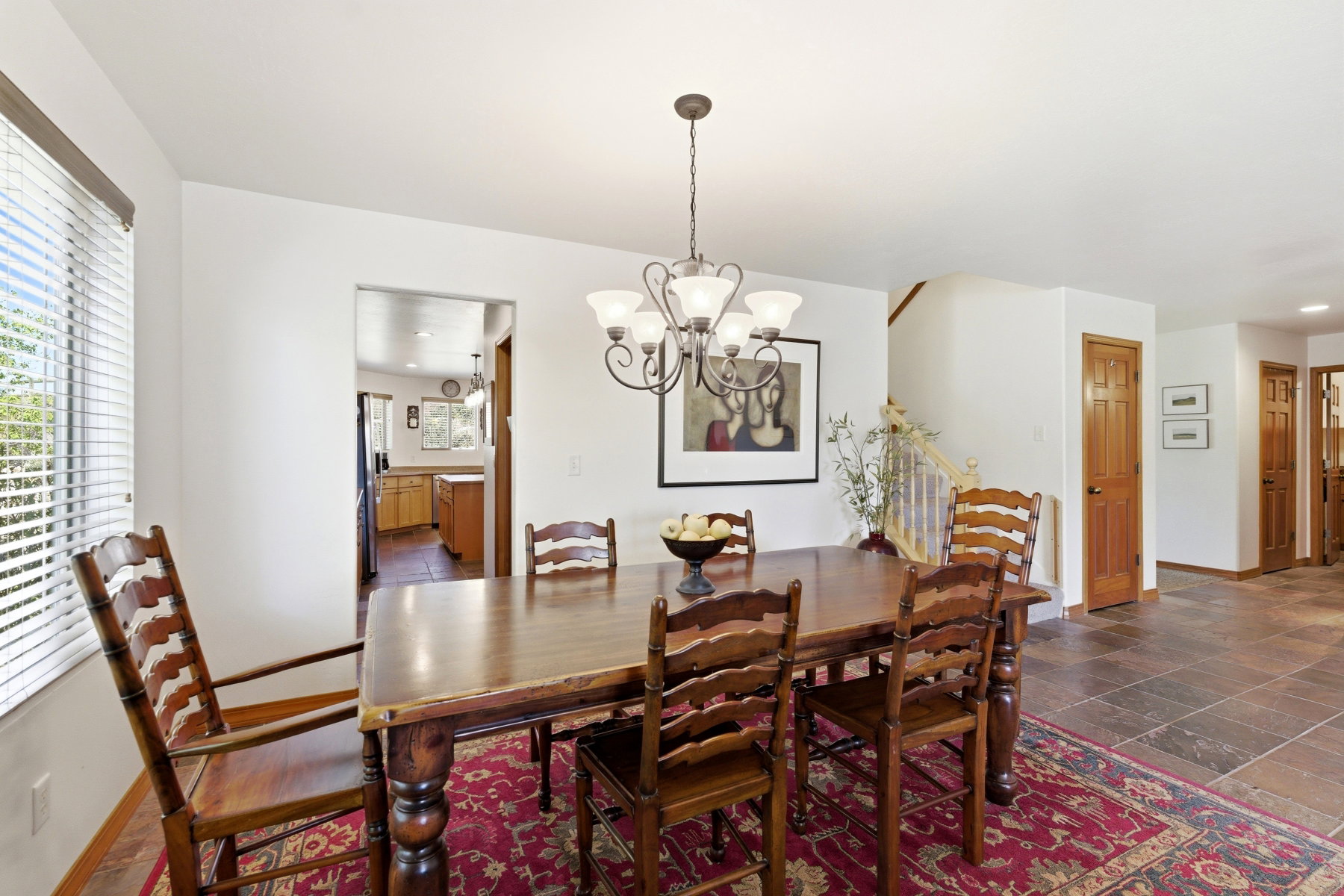 Dining area featuring a chandelier and wood-finish flooring