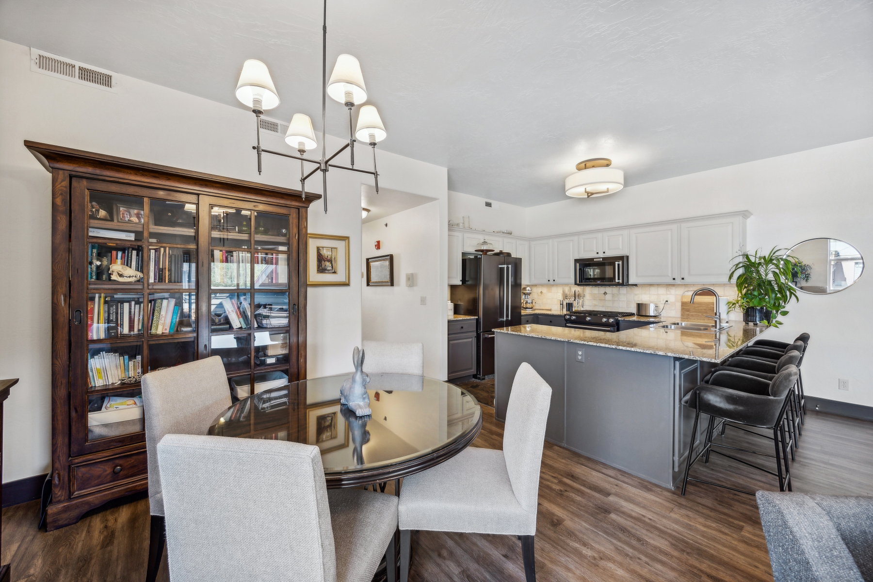 Kitchen and dining area featuring wood-finish flooring
