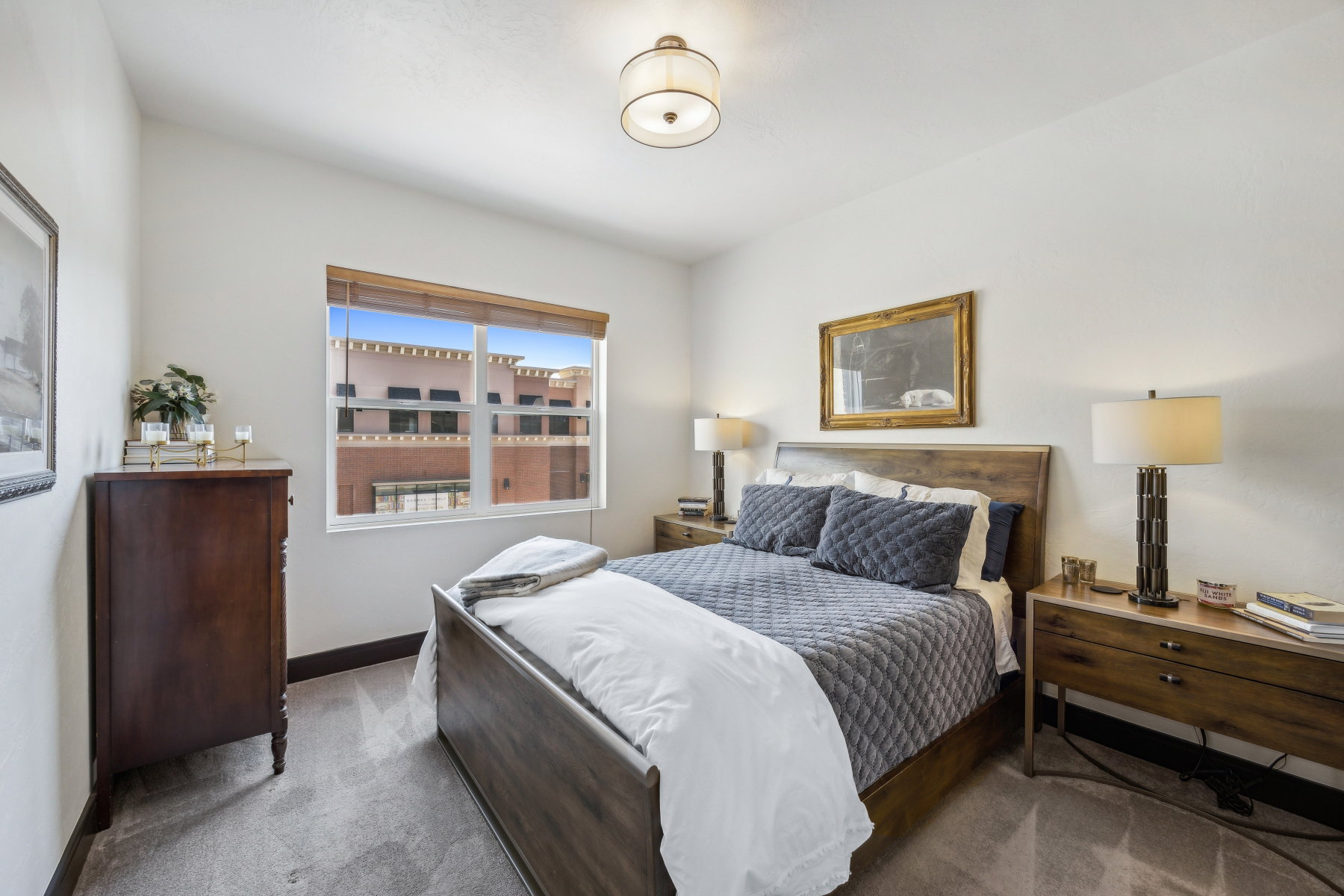 Bedroom featuring light-colored walls and grey carpet flooring