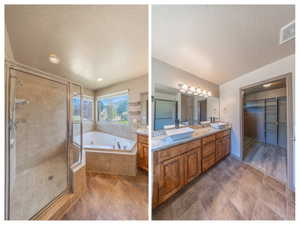 Spacious bathroom featuring a glass-enclosed shower, corner soaking tub, dual vessel sinks atop a granite-finish vanity, and a separate walk-in closet with built-in shelving