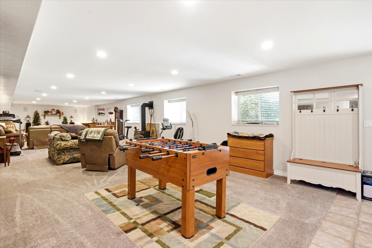 Spacious lower level featuring recessed lighting, carpeted flooring, and multiple windows