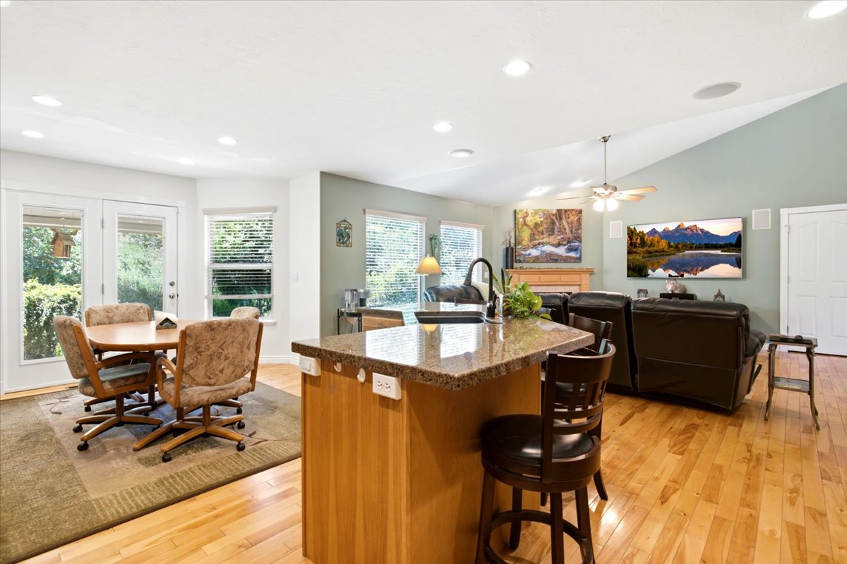Kitchen island with a granite countertop and an undermount sink