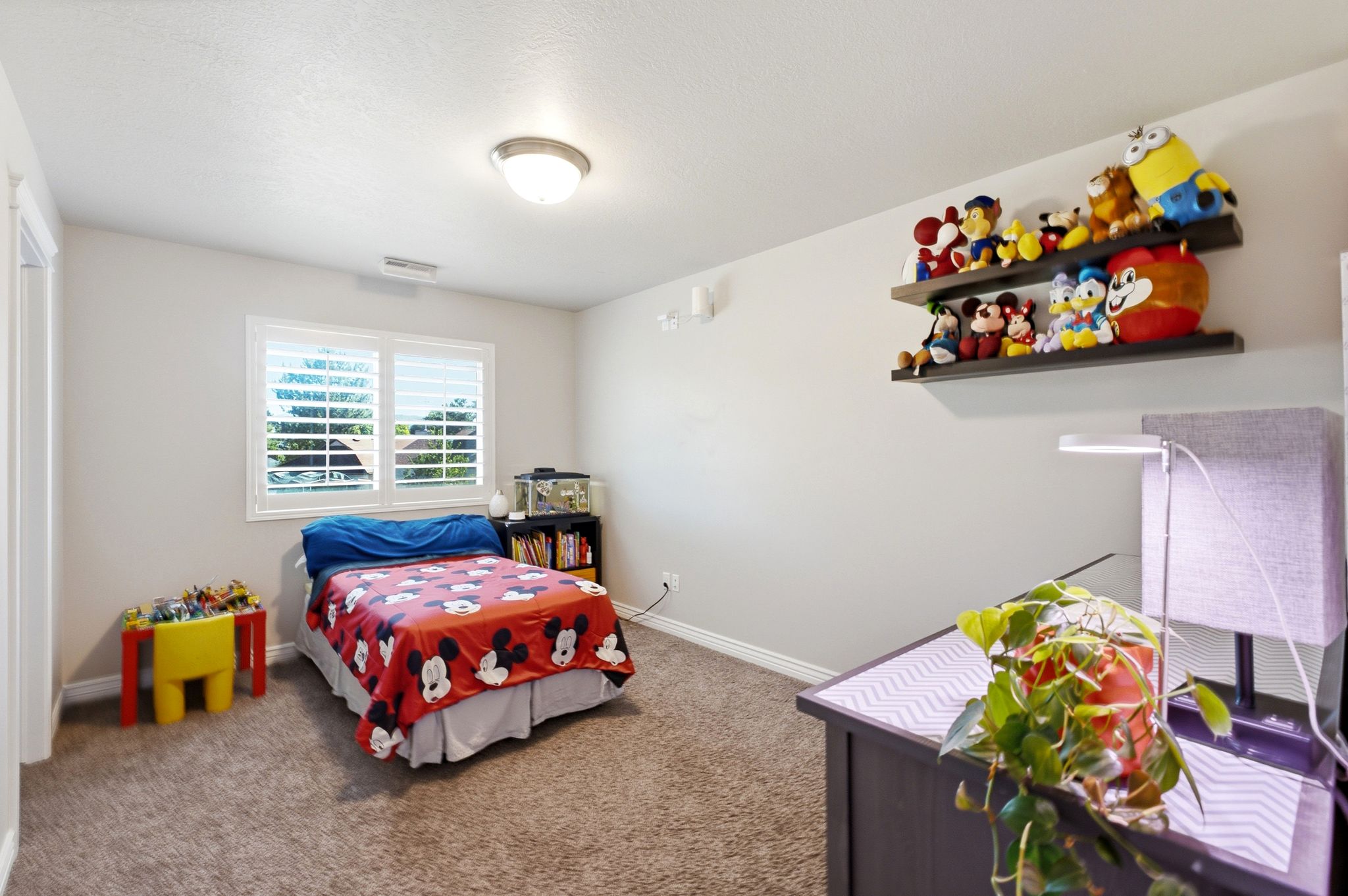 Bedroom featuring neutral wall paint and carpeted flooring