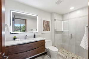 Contemporary vanity with a wood-finish base, integrated rectangular sink, and stone-finish countertop