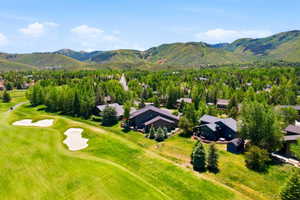 Expansive golf course frontage featuring manicured greens and sand traps