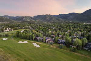 Expansive golf course frontage with sand traps and green fairways
